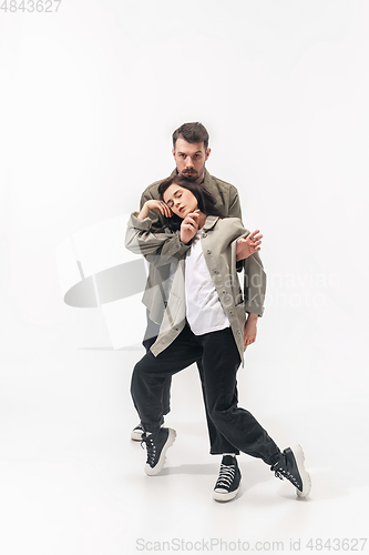 Image of Trendy fashionable couple isolated on white studio background