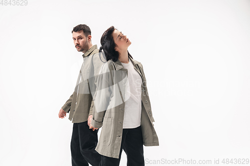 Image of Trendy fashionable couple isolated on white studio background