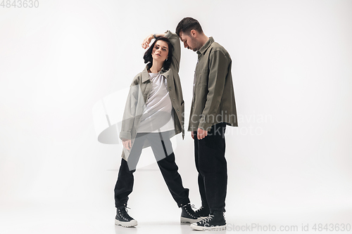 Image of Trendy fashionable couple isolated on white studio background