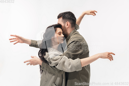 Image of Trendy fashionable couple isolated on white studio background