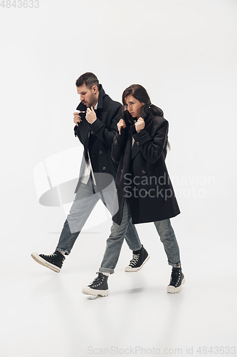 Image of Trendy fashionable couple isolated on white studio background