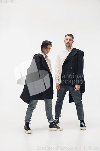 Image of Trendy fashionable couple isolated on white studio background