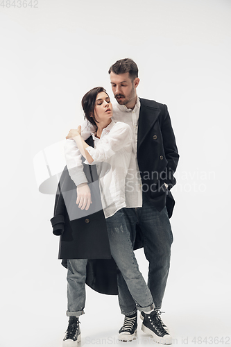 Image of Trendy fashionable couple isolated on white studio background