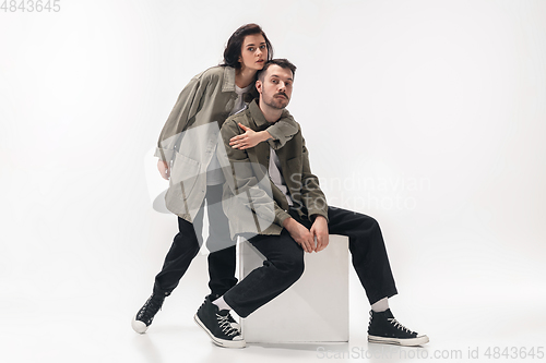 Image of Trendy fashionable couple isolated on white studio background