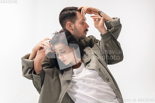 Image of Trendy fashionable couple isolated on white studio background