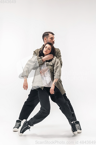 Image of Trendy fashionable couple isolated on white studio background