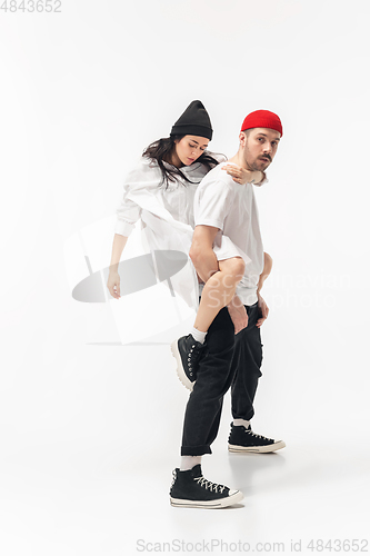 Image of Trendy fashionable couple isolated on white studio background