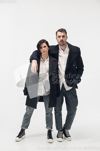 Image of Trendy fashionable couple isolated on white studio background