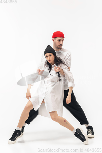 Image of Trendy fashionable couple isolated on white studio background