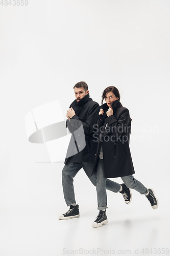 Image of Trendy fashionable couple isolated on white studio background