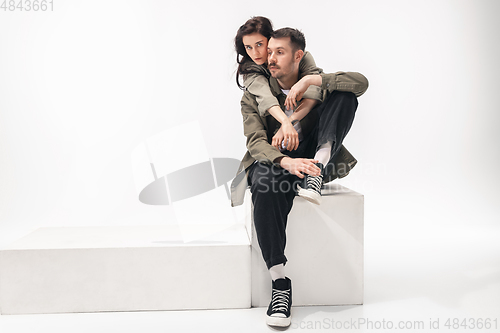 Image of Trendy fashionable couple isolated on white studio background