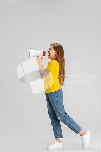 Image of Happy kid, girl isolated on white studio background. Looks happy, cheerful, sincere. Copyspace. Childhood, education, emotions concept