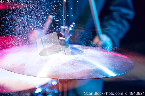 Image of Drummer\'s rehearsing on drums before rock concert. Man recording music on drumset in studio