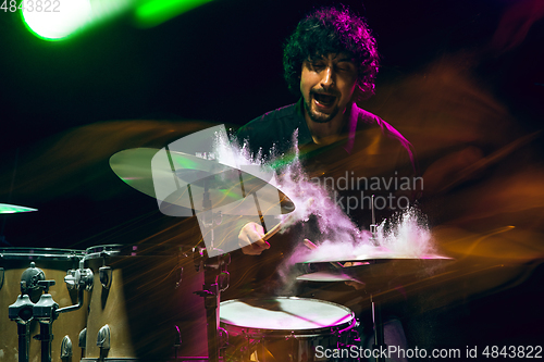 Image of Drummer\'s rehearsing on drums before rock concert. Man recording music on drumset in studio