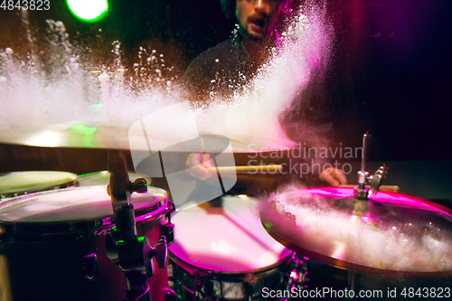 Image of Drummer\'s rehearsing on drums before rock concert. Man recording music on drumset in studio