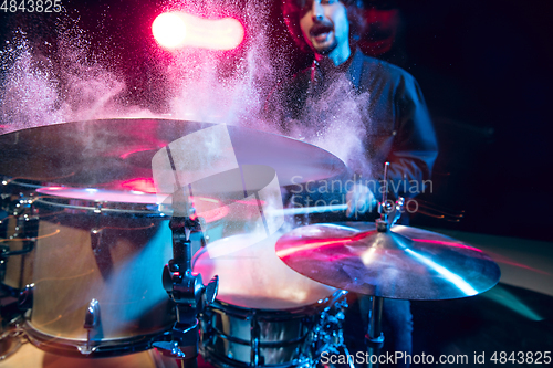 Image of Drummer\'s rehearsing on drums before rock concert. Man recording music on drumset in studio