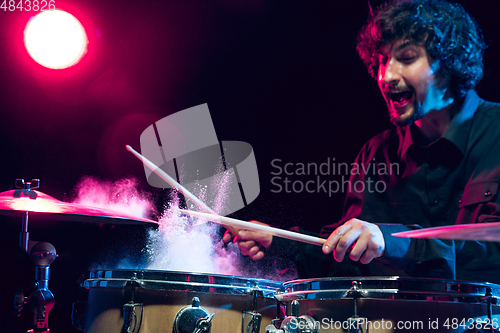 Image of Drummer\'s rehearsing on drums before rock concert. Man recording music on drumset in studio