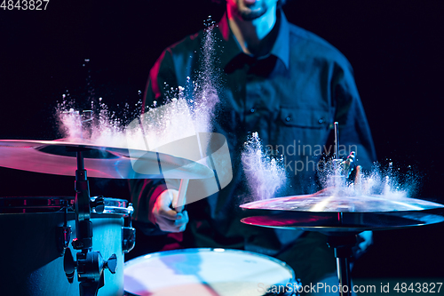 Image of Drummer\'s rehearsing on drums before rock concert. Man recording music on drumset in studio