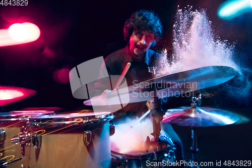 Image of Drummer\'s rehearsing on drums before rock concert. Man recording music on drumset in studio