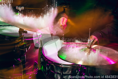 Image of Drummer\'s rehearsing on drums before rock concert. Man recording music on drumset in studio