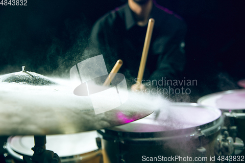 Image of Drummer\'s rehearsing on drums before rock concert. Man recording music on drumset in studio