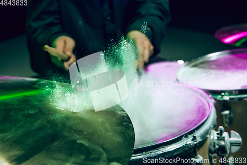 Image of Drummer\'s rehearsing on drums before rock concert. Man recording music on drumset in studio