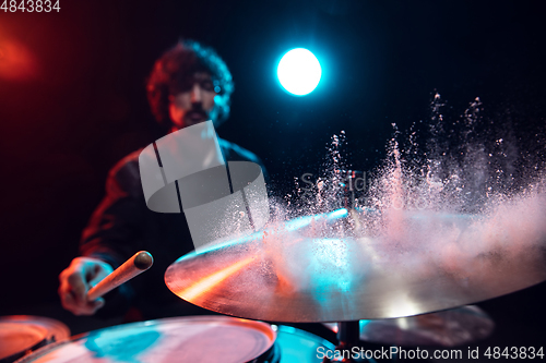 Image of Drummer\'s rehearsing on drums before rock concert. Man recording music on drumset in studio