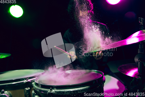 Image of Drummer\'s rehearsing on drums before rock concert. Man recording music on drumset in studio