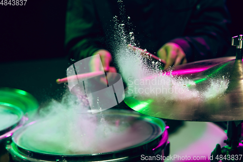 Image of Drummer\'s rehearsing on drums before rock concert. Man recording music on drumset in studio