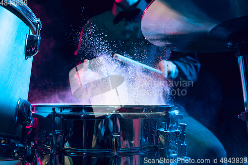 Image of Drummer\'s rehearsing on drums before rock concert. Man recording music on drumset in studio