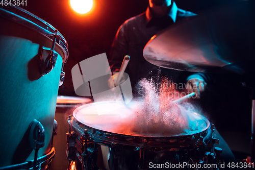 Image of Drummer\'s rehearsing on drums before rock concert. Man recording music on drumset in studio