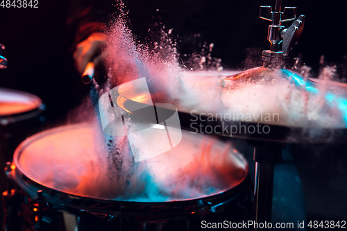 Image of Drummer\'s rehearsing on drums before rock concert. Man recording music on drumset in studio