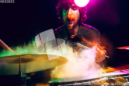 Image of Drummer\'s rehearsing on drums before rock concert. Man recording music on drumset in studio