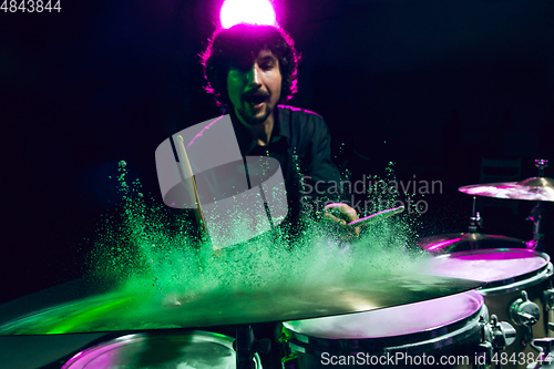 Image of Drummer\'s rehearsing on drums before rock concert. Man recording music on drumset in studio