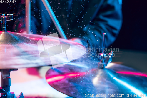 Image of Drummer\'s rehearsing on drums before rock concert. Man recording music on drumset in studio