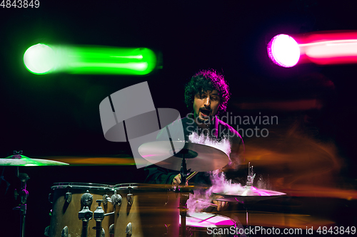 Image of Drummer\'s rehearsing on drums before rock concert. Man recording music on drumset in studio