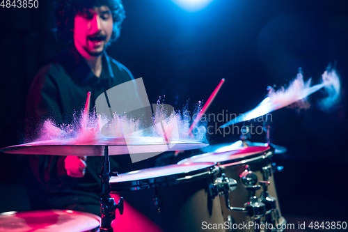 Image of Drummer\'s rehearsing on drums before rock concert. Man recording music on drumset in studio