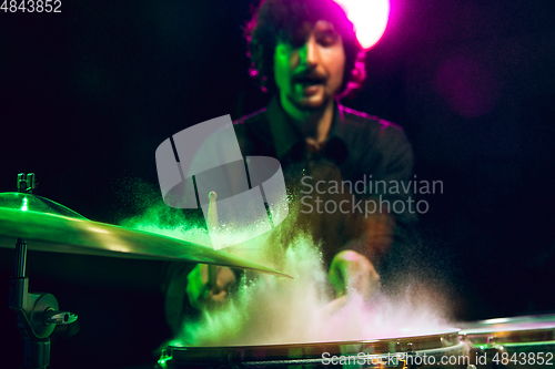 Image of Drummer\'s rehearsing on drums before rock concert. Man recording music on drumset in studio