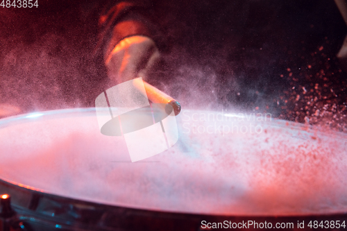 Image of Drummer\'s rehearsing on drums before rock concert. Man recording music on drumset in studio