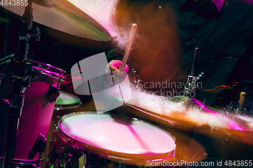 Image of Drummer\'s rehearsing on drums before rock concert. Man recording music on drumset in studio