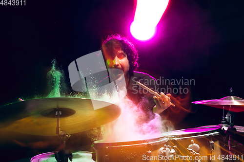 Image of Drummer\'s rehearsing on drums before rock concert. Man recording music on drumset in studio