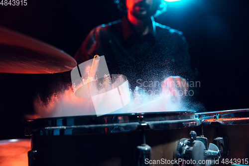 Image of Drummer\'s rehearsing on drums before rock concert. Man recording music on drumset in studio