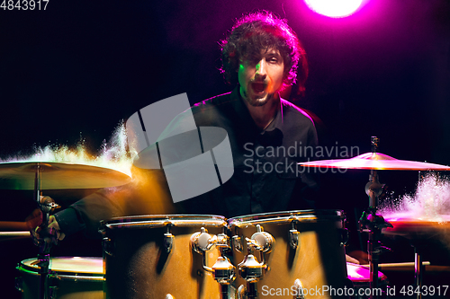 Image of Drummer\'s rehearsing on drums before rock concert. Man recording music on drumset in studio