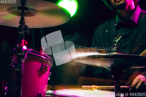 Image of Drummer\'s rehearsing on drums before rock concert. Man recording music on drumset in studio