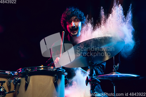 Image of Drummer\'s rehearsing on drums before rock concert. Man recording music on drumset in studio