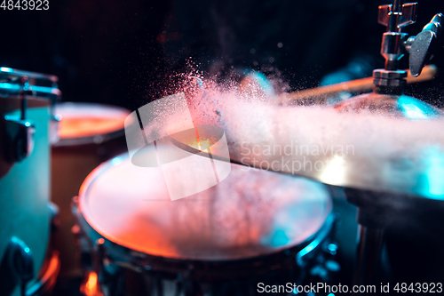 Image of Drummer\'s rehearsing on drums before rock concert. Man recording music on drumset in studio