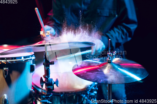 Image of Drummer\'s rehearsing on drums before rock concert. Man recording music on drumset in studio