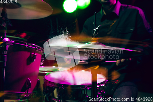 Image of Drummer\'s rehearsing on drums before rock concert. Man recording music on drumset in studio