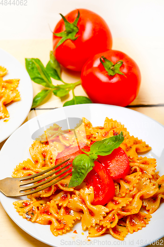 Image of Italian pasta farfalle butterfly bow-tie and tomato sauce