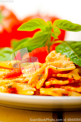 Image of Italian pasta farfalle butterfly bow-tie and tomato sauce